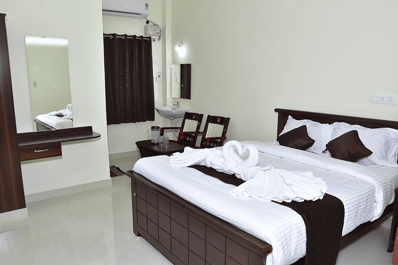 Elegant deluxe AC room at Sri Madhava Residency with modern decor