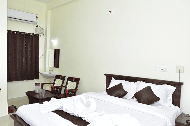 Cozy single bed in a standard room at Sri Madhava Residency